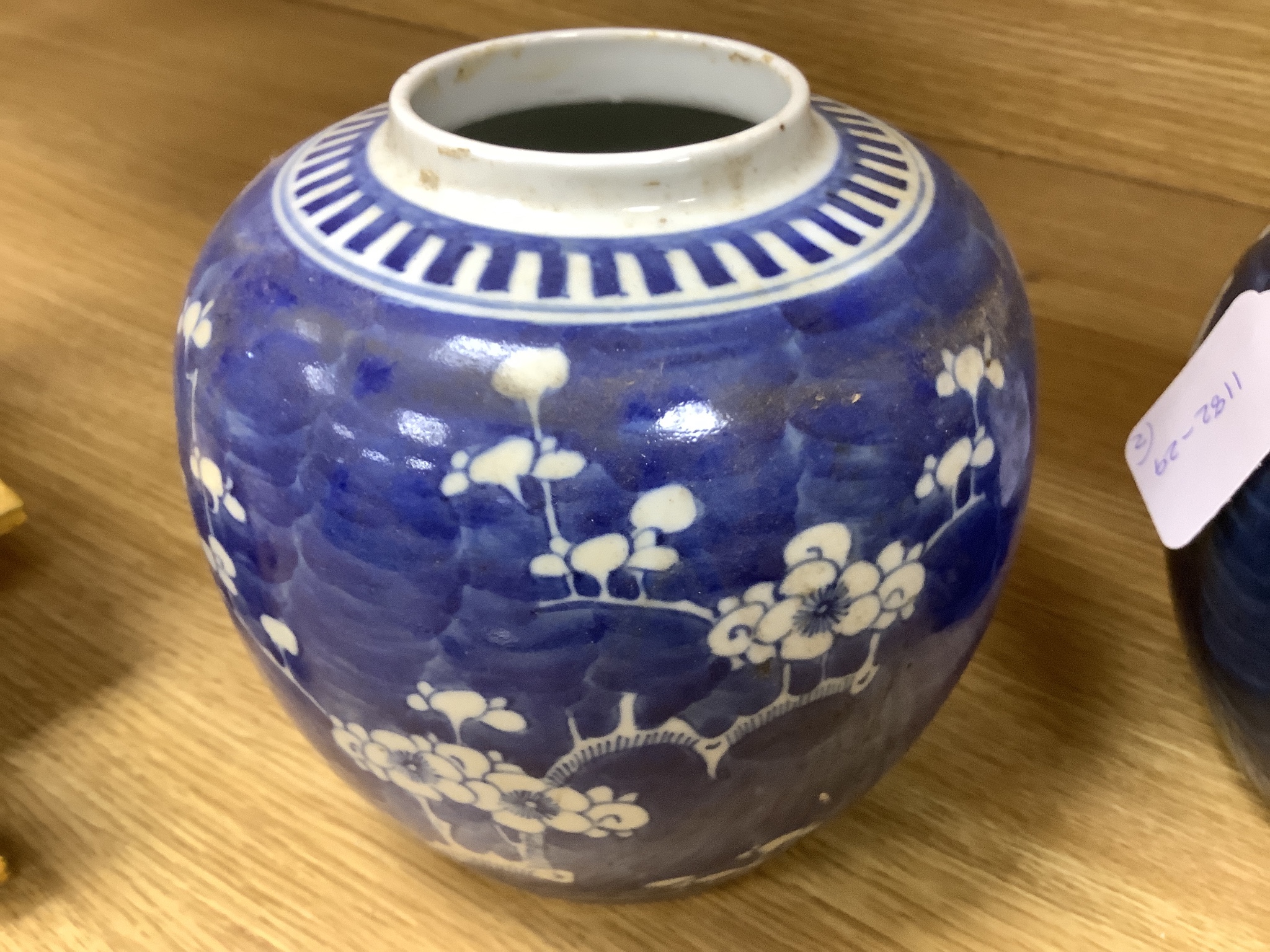 Two early 20th century Chinese blue and white prunus jars, tallest 16cm